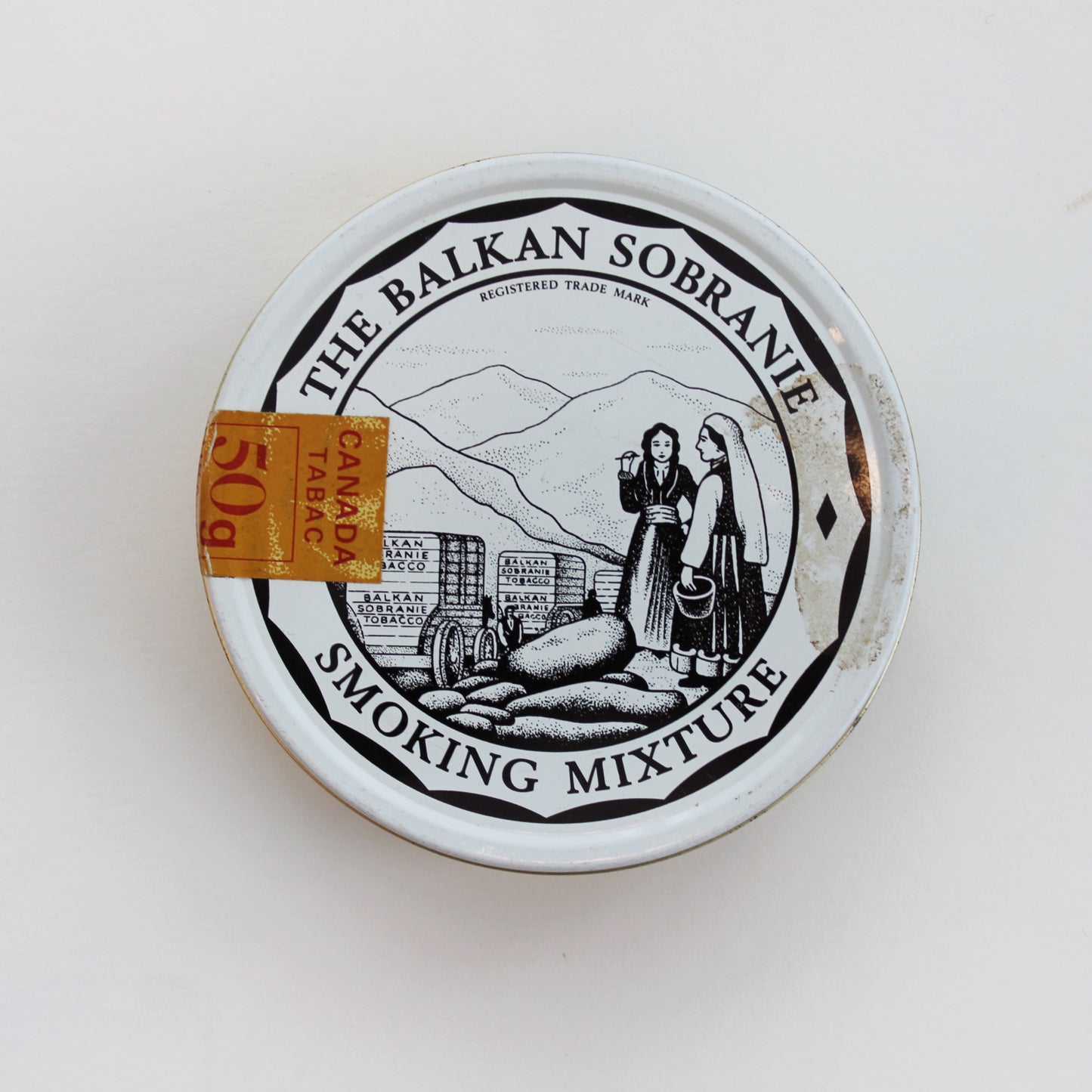 "Cheshire cat" tin with lid