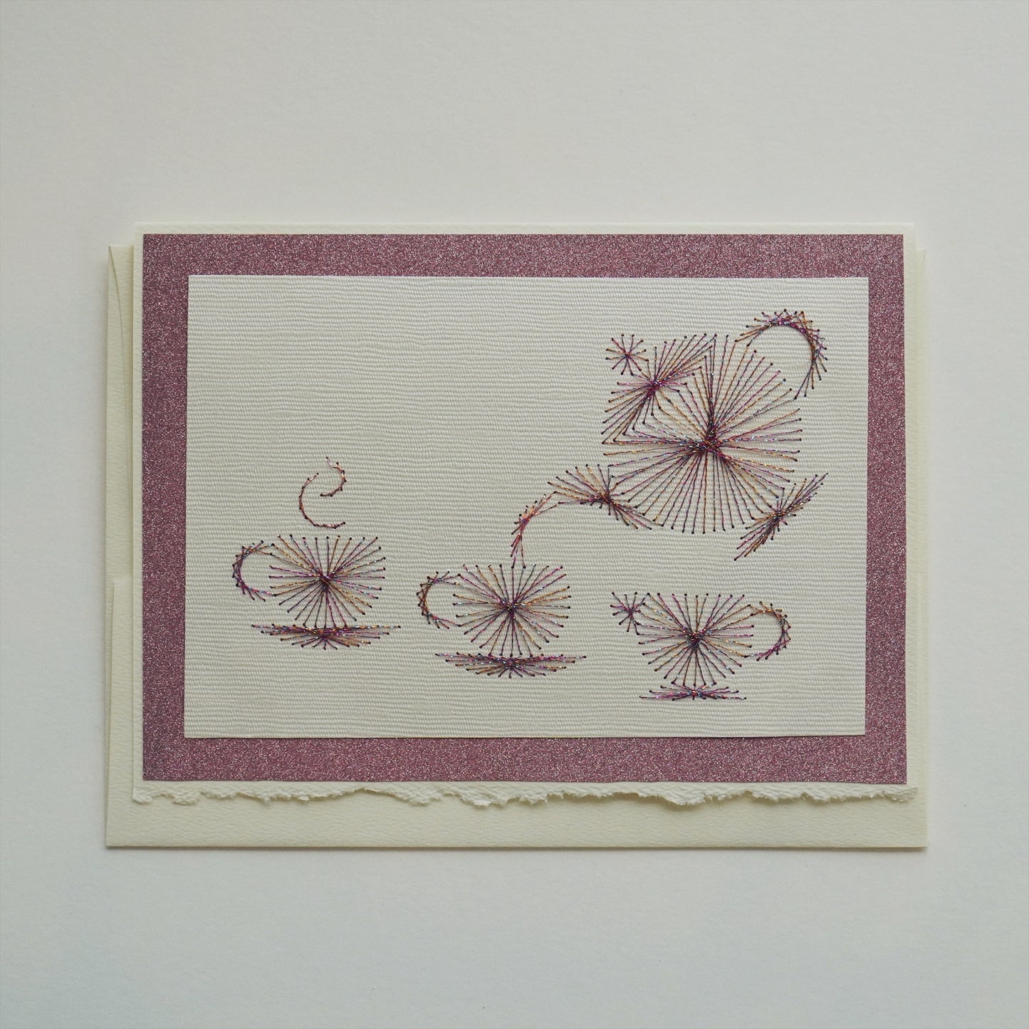 Teapot, two cups and creamer in rose-violet card