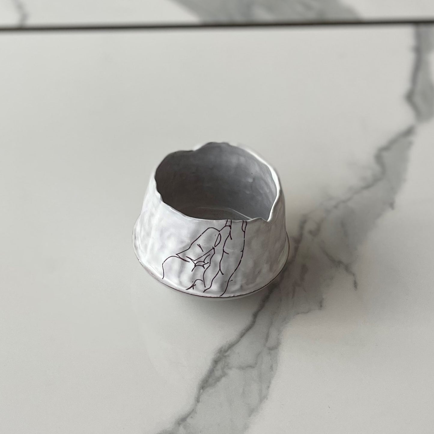 Small bowl with abstract hands